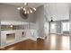 View of the Living Space with Hardwood floors, vaulted ceilings and view to a Fireplace at 4718 Dancer Dr, Indianapolis, IN 46237