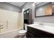 Clean bathroom features a shower/tub combo, vanity and ample storage at 5380 Collett E Dr, Camby, IN 46113