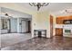A kitchen and attached dining room combo features laminate flooring and an open entryway to the living room at 5380 Collett E Dr, Camby, IN 46113