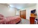 Cozy bedroom with closet, tv and neutral color scheme at 5431 Nathan Pl, Indianapolis, IN 46237