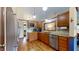 Spacious kitchen offers stainless steel appliances, wood cabinets and eat-in dining at 5431 Nathan Pl, Indianapolis, IN 46237