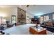 Spacious living room featuring a stone fireplace, vaulted ceilings, and comfortable seating at 5431 Nathan Pl, Indianapolis, IN 46237
