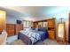 Main bedroom featuring wood furnishings, a bed and views to the exterior at 5431 Nathan Pl, Indianapolis, IN 46237