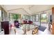 Bright sunroom with a vaulted ceiling, tiled floors, and multiple windows at 5431 Nathan Pl, Indianapolis, IN 46237