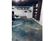 Unfinished basement featuring concrete floors, block wall, and exposed ceiling beams ready for customization at 547 N Livingston Ave, Indianapolis, IN 46222