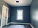 Bedroom with neutral wall paint and plenty of natural light through its window at 547 N Livingston Ave, Indianapolis, IN 46222
