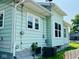 Back of house with siding, windows, lawn, and utilities at 547 N Livingston Ave, Indianapolis, IN 46222