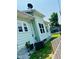 Side of house with windows, siding, and a small yard area at 547 N Livingston Ave, Indianapolis, IN 46222