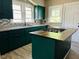 Modern kitchen featuring stainless steel appliances, granite countertops, and a center island with a stovetop at 547 N Livingston Ave, Indianapolis, IN 46222