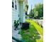 Side yard featuring a lawn area, utilities, and gravel landscaping at 547 N Livingston Ave, Indianapolis, IN 46222