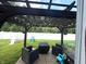 Backyard showcasing a pergola-covered patio with outdoor seating and string lights at 5702 Deer Valley Ct, Columbus, IN 47201