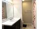 Bathroom featuring a vanity with a sink, toilet, and a shower with a peach patterned curtain at 5702 Deer Valley Ct, Columbus, IN 47201