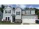Charming two-story home featuring gray siding, black shutters, and a well-manicured front lawn at 5702 Deer Valley Ct, Columbus, IN 47201