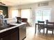 Bright kitchen and dining area with stainless steel appliances and modern decor at 5702 Deer Valley Ct, Columbus, IN 47201