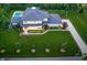 Expansive property with a manicured lawn, swimming pool and charming architectural details at 5946 Stafford Way, Indianapolis, IN 46228