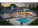 Inviting backyard oasis with a sparkling pool, lounge chairs, and patio furniture at 5946 Stafford Way, Indianapolis, IN 46228