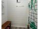 Bathroom with a bench and a shower with a curtain featuring a white background and tropical leaf print at 5946 Stafford Way, Indianapolis, IN 46228