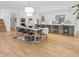 Spacious kitchen with a dining area, stainless steel appliances, and white cabinetry at 5946 Stafford Way, Indianapolis, IN 46228