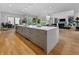 Spacious open-concept kitchen featuring a large island and access to the outdoor patio at 5946 Stafford Way, Indianapolis, IN 46228