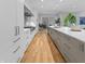 Contemporary kitchen with stainless steel appliances, custom cabinetry, and hardwood floors at 5946 Stafford Way, Indianapolis, IN 46228