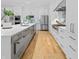Stylish modern kitchen with ample storage, stainless appliances, and a large kitchen island at 5946 Stafford Way, Indianapolis, IN 46228