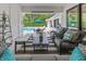 Covered patio with a view of the pool, patio furniture, an outdoor seating area, and a backyard at 5946 Stafford Way, Indianapolis, IN 46228