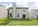 Expansive backyard showcasing a lush lawn, patio, and beautiful outdoor space at 5966 Draycott Dr, Indianapolis, IN 46236