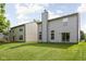 Wide backyard view featuring a big lawn, and mature trees creating a serene outdoor space at 5966 Draycott Dr, Indianapolis, IN 46236