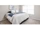 Comfortable bedroom with a plush bed, soft carpet, and plenty of natural light at 5966 Draycott Dr, Indianapolis, IN 46236
