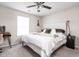 Comfortable bedroom featuring a queen-size bed, large window, and minimalist decor at 5966 Draycott Dr, Indianapolis, IN 46236