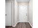 Inviting entryway with updated flooring and natural light streaming through the front door at 5966 Draycott Dr, Indianapolis, IN 46236