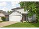 Charming two-story home with a two-car garage, tidy landscaping, and inviting front porch at 5966 Draycott Dr, Indianapolis, IN 46236