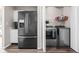 Combined laundry and kitchen area with gray washer/dryer and stainless steel refrigerator at 5966 Draycott Dr, Indianapolis, IN 46236