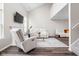 Bright living room featuring a fireplace, large windows, and comfortable seating at 5966 Draycott Dr, Indianapolis, IN 46236