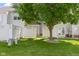 Grassy backyard area surrounded by a white fence and a large tree at 603 Daviess Dr, Westfield, IN 46074