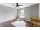 This bedroom has a ceiling fan, a gray rug, and a window with natural light at 603 Daviess Dr, Westfield, IN 46074