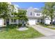 Charming townhouse with attached garage, landscaped front yard, and a tree in a bed of rocks at 603 Daviess Dr, Westfield, IN 46074