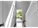 Bright foyer with hardwood floors, stairs and a view of the front door at 603 Daviess Dr, Westfield, IN 46074