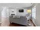 Open-concept living room with hardwood floors, fireplace, and a comfortable sofa at 603 Daviess Dr, Westfield, IN 46074