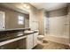 Bathroom featuring a tub-shower, neutral tile, and modern fixtures at 6114 Pebblebrooke Rd, Whitestown, IN 46075