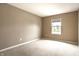 Neutral bedroom showcasing light carpet, walls, and natural light through window at 6114 Pebblebrooke Rd, Whitestown, IN 46075