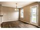 Cozy dining area with modern light fixture and lots of natural light at 6114 Pebblebrooke Rd, Whitestown, IN 46075