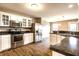 Kitchen with stainless appliances, ample countertop space and open floor plan at 6114 Pebblebrooke Rd, Whitestown, IN 46075