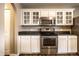 Kitchen with stainless appliances, and bright white cabinets at 6114 Pebblebrooke Rd, Whitestown, IN 46075