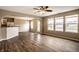 Open-concept living room with lots of natural light and hardwood floors at 6114 Pebblebrooke Rd, Whitestown, IN 46075
