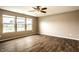Bright living room with beautiful flooring and large windows overlooking the lake at 6114 Pebblebrooke Rd, Whitestown, IN 46075