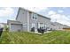 Spacious backyard with lush green lawn and a patio for outdoor enjoyment at 6305 N Woodhaven Dr, McCordsville, IN 46055