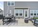 Well-appointed outdoor patio with a dining set and lounge seating, perfect for relaxation at 6305 N Woodhaven Dr, McCordsville, IN 46055