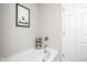 Bright bathroom showcases a white tub with elegant fixtures and decor at 6305 N Woodhaven Dr, McCordsville, IN 46055