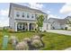 A two-story home with well-maintained landscaping, a spacious lawn, and a welcoming front porch at 6305 N Woodhaven Dr, McCordsville, IN 46055
